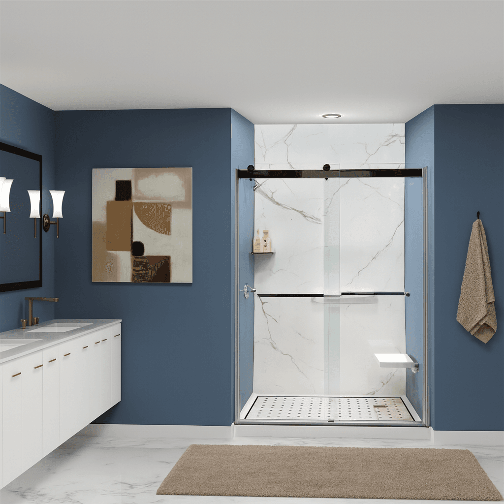 Modern bathroom with blue walls and a white marble shower with a built-in folding shower bench seat. Features a sleek vanity with a large mirror, abstract art, and soft lighting.