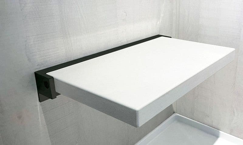 A white folding shower bench seat.