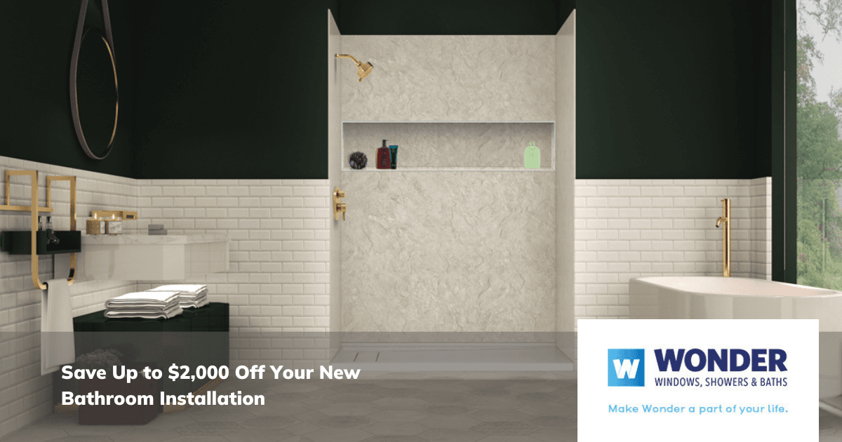 Modern bathroom with a marble shower, gold fixtures, dark green walls, and white tile. Text: "Save Up to $2,000 Off Your New Bathroom Installation." Wonder Windows, Showers & Baths logo.