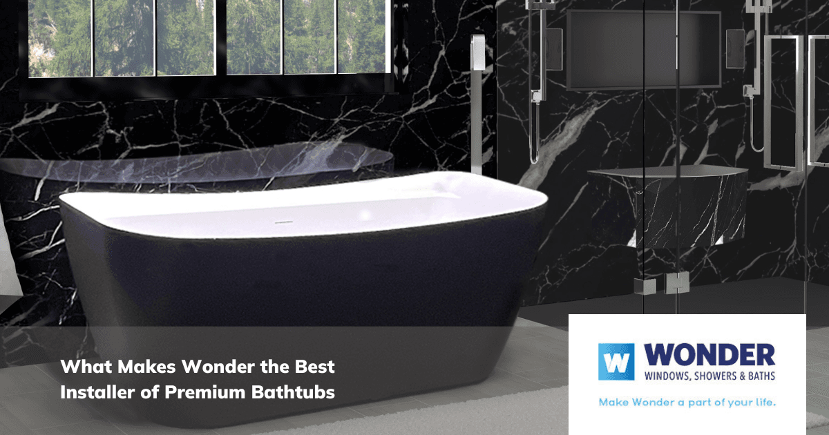 A sleek black bathtub sits in a luxurious bathroom with black marble walls. Sunlight filters through a window. Text reads, "What Makes Wonder the Best Installer of Premium Bathtubs."