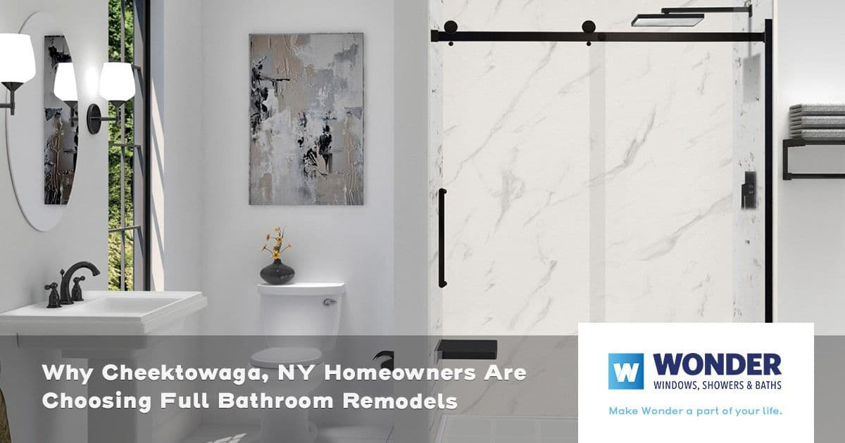 Modern bathroom with marble shower, white sink, and toilet. Sleek fixtures, abstract wall art, and soft lighting create a serene and elegant vibe.