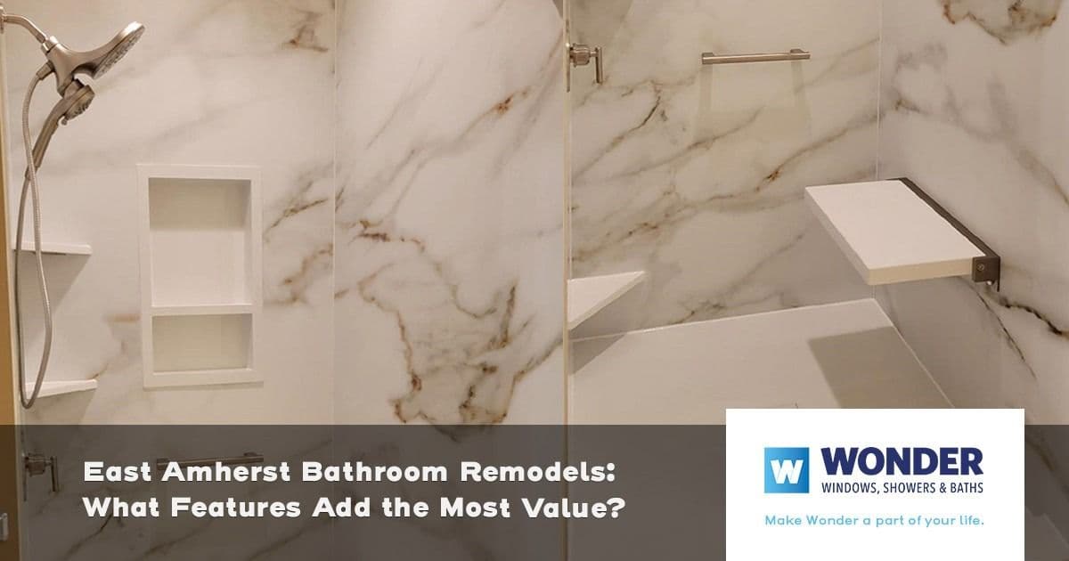 Alt text: Modern bathroom with marble walls, minimalist shelving, and a sleek showerhead. Text overlay reads: "East Amherst Bathroom Remodels: What Features Add the Most Value?" Logo in corner.