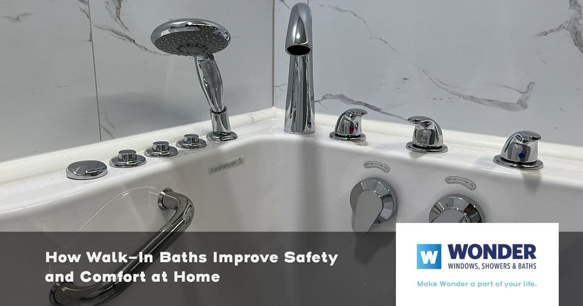 Close-up of a modern walk-in bathtub with chrome fixtures, handheld showerhead, and multiple controls. Text overlay: "How Walk-In Baths Improve Safety and Comfort at Home." Wonder logo in the bottom right.