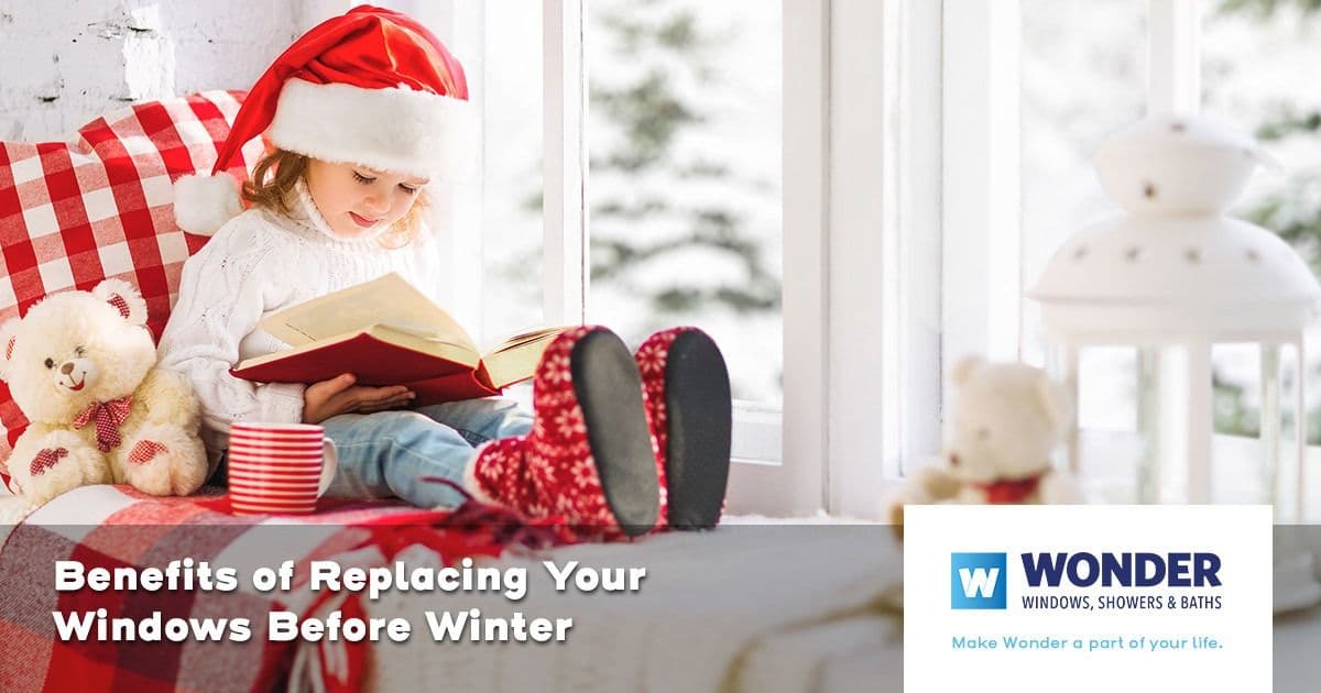 A child in a Santa hat reads a book by a snowy window. Nearby are a teddy bear and a mug. Text reads: "Benefits of Replacing Your Windows Before Winter."