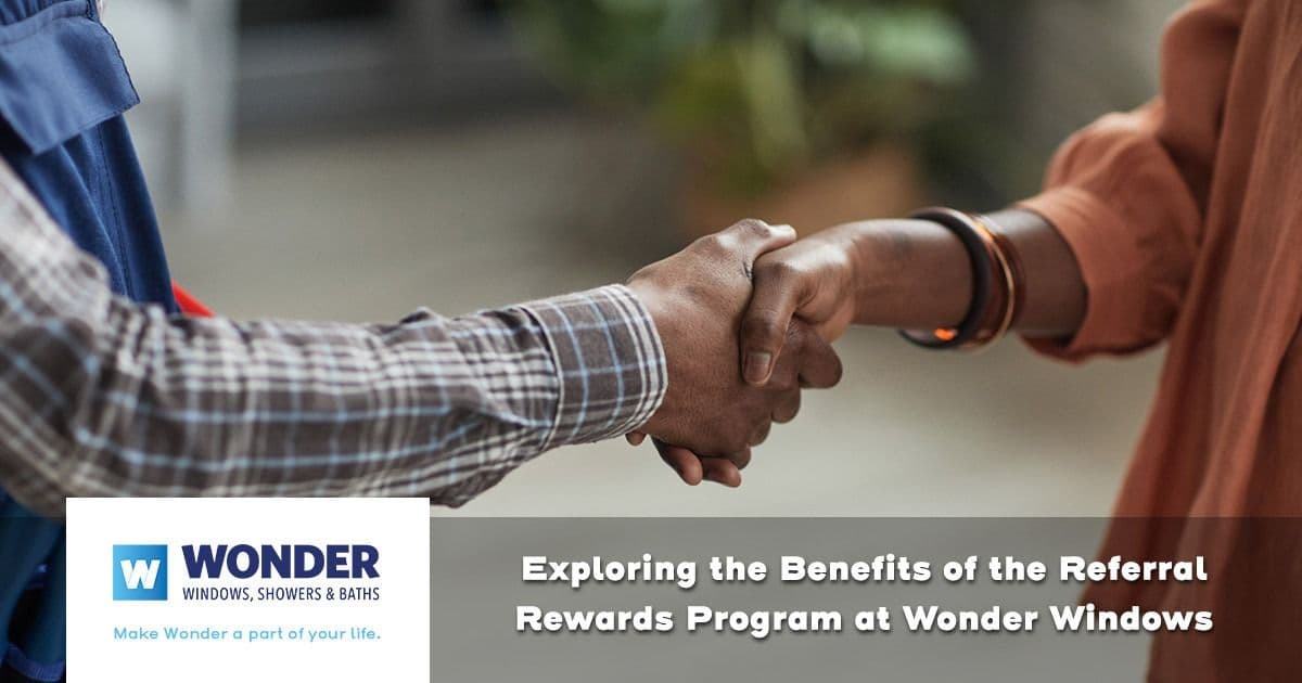 Two people shaking hands, wearing business attire, symbolizing agreement or partnership. Text promotes a referral program for Wonder Windows.