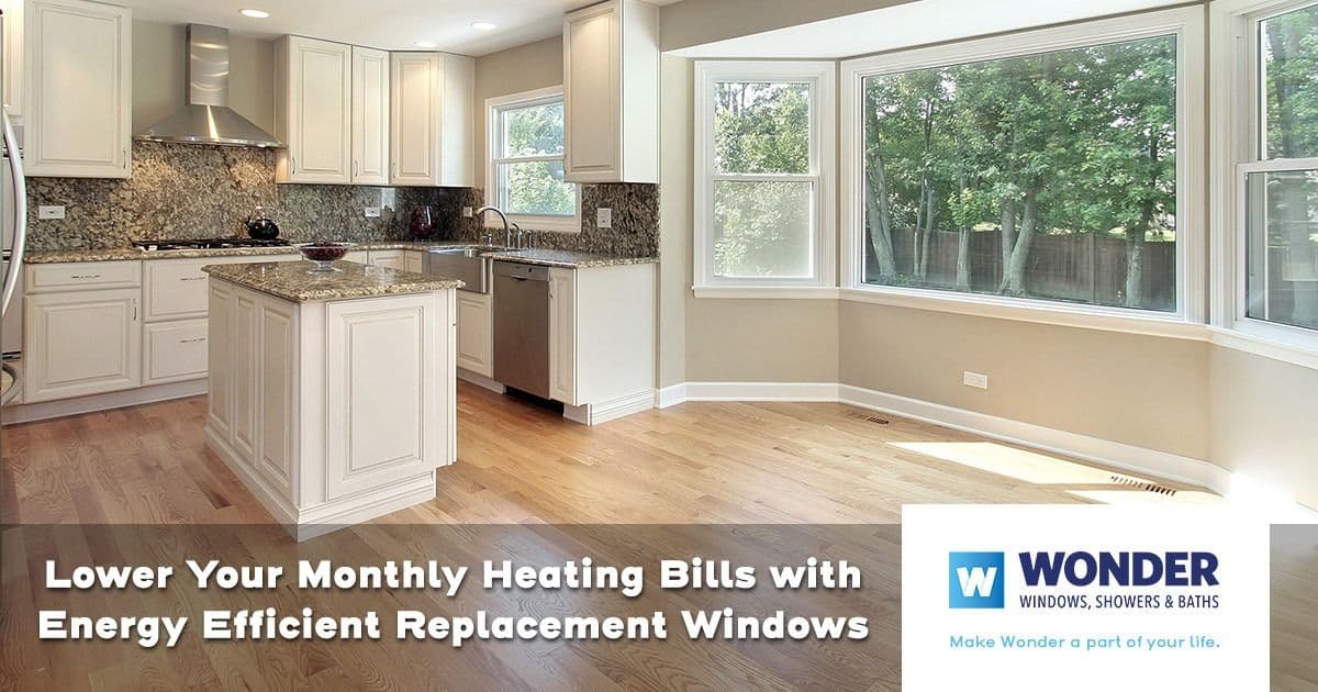 Bright kitchen with white cabinets, marble countertops, and large energy-efficient windows letting in natural light. Text promotes lower heating bills.
