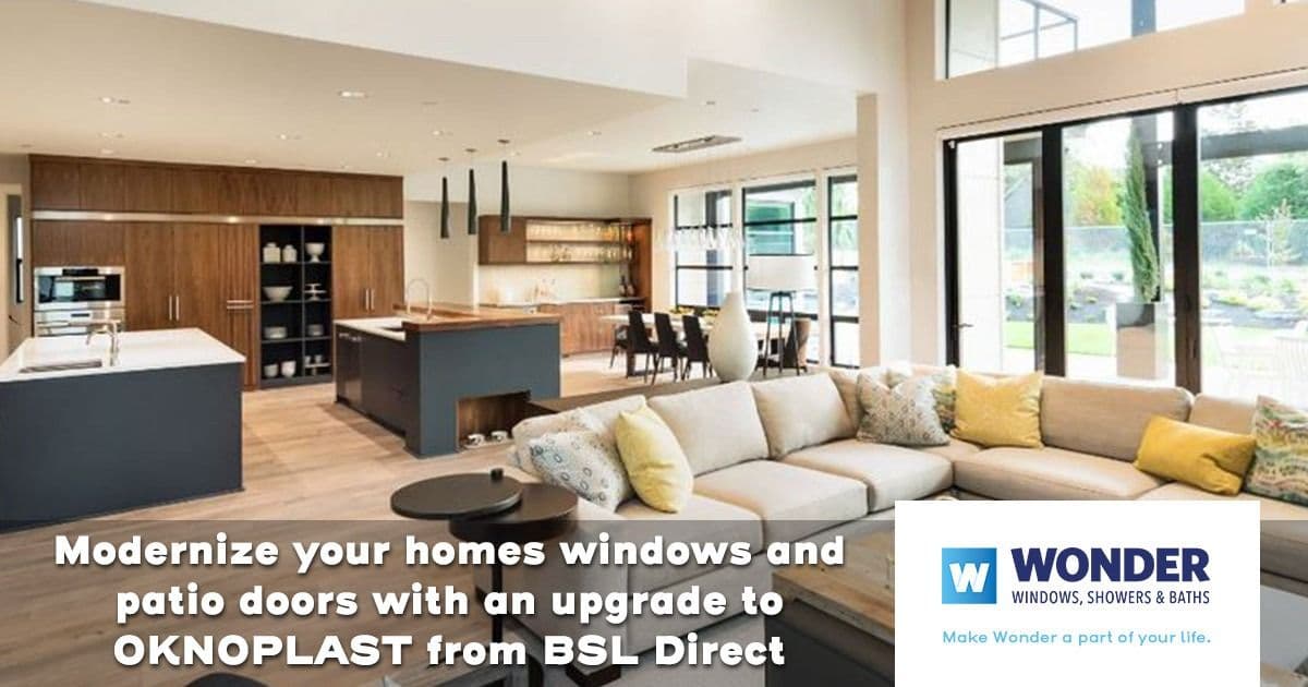 Modern living room with large windows and patio doors overlooking a garden. Features a beige sectional sofa, cushions, and an open kitchen. Text overlay promotes OKNOPLAST windows.