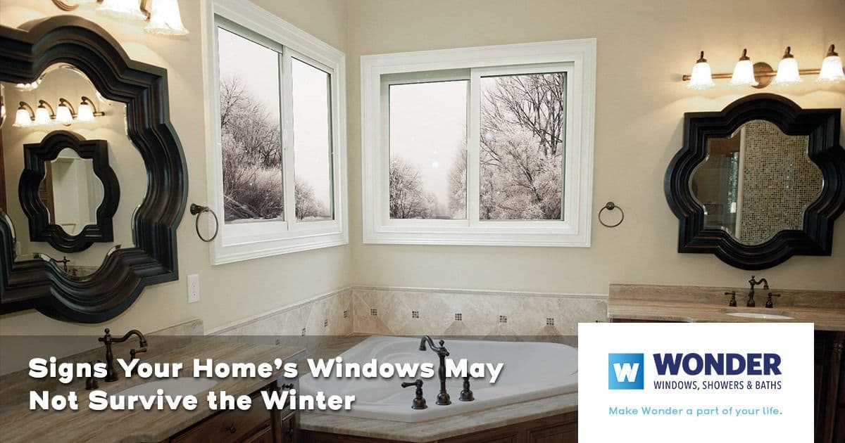Elegant bathroom with double mirrors, under soft lighting. Winter scenes visible through windows. Text reads, "Signs Your Home’s Windows May Not Survive the Winter."