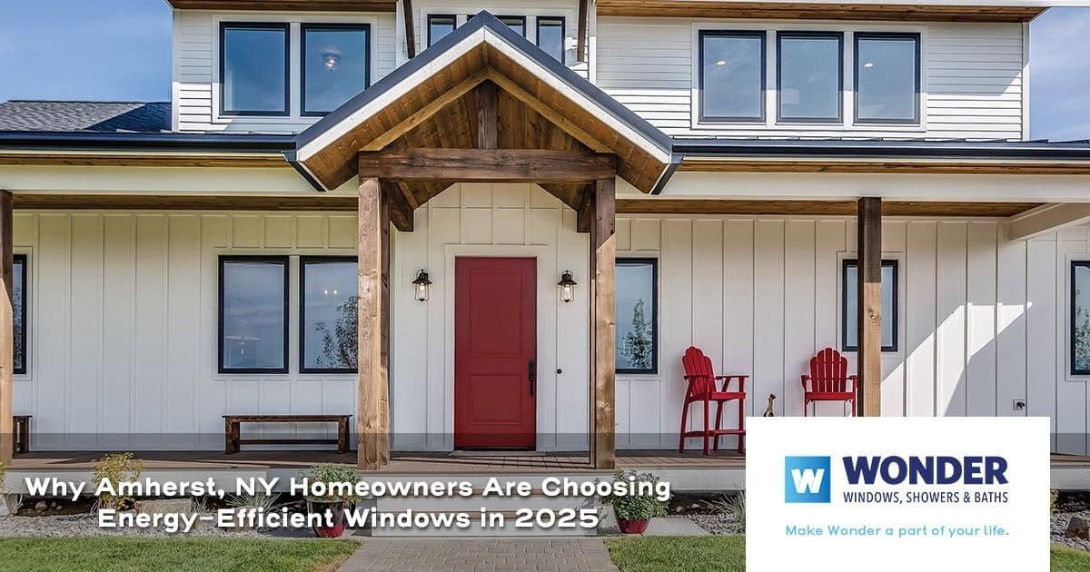 Modern home exterior with energy-efficient windows, a red front door, and a wooden porch. Text overlay about Amherst, NY homeowners choosing these windows in 2025. Wonder Windows logo present.