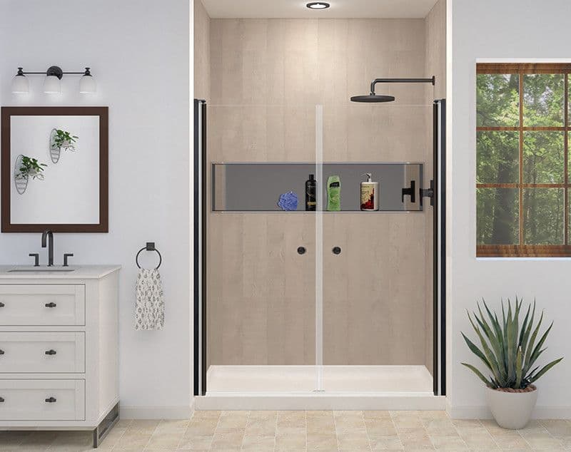 Modern bathroom with beige tiled shower featuring a black rain showerhead and glass doors. White vanity with mirror, light fixture, and plant decor.